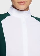 Close-up of a white shirt with green sleeves on a neutral background