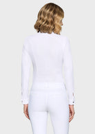 Person wearing a white outfit on a plain background