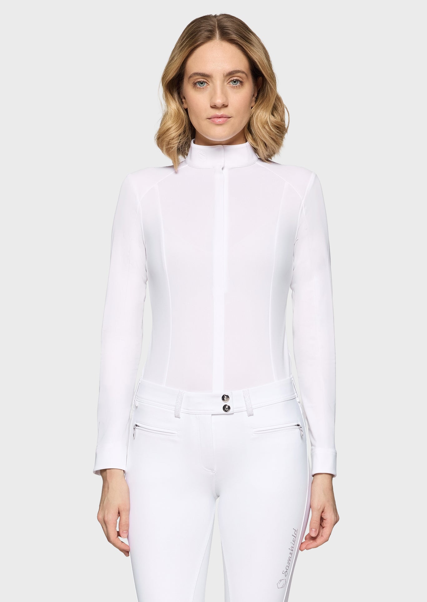 Woman wearing a white outfit on a white background