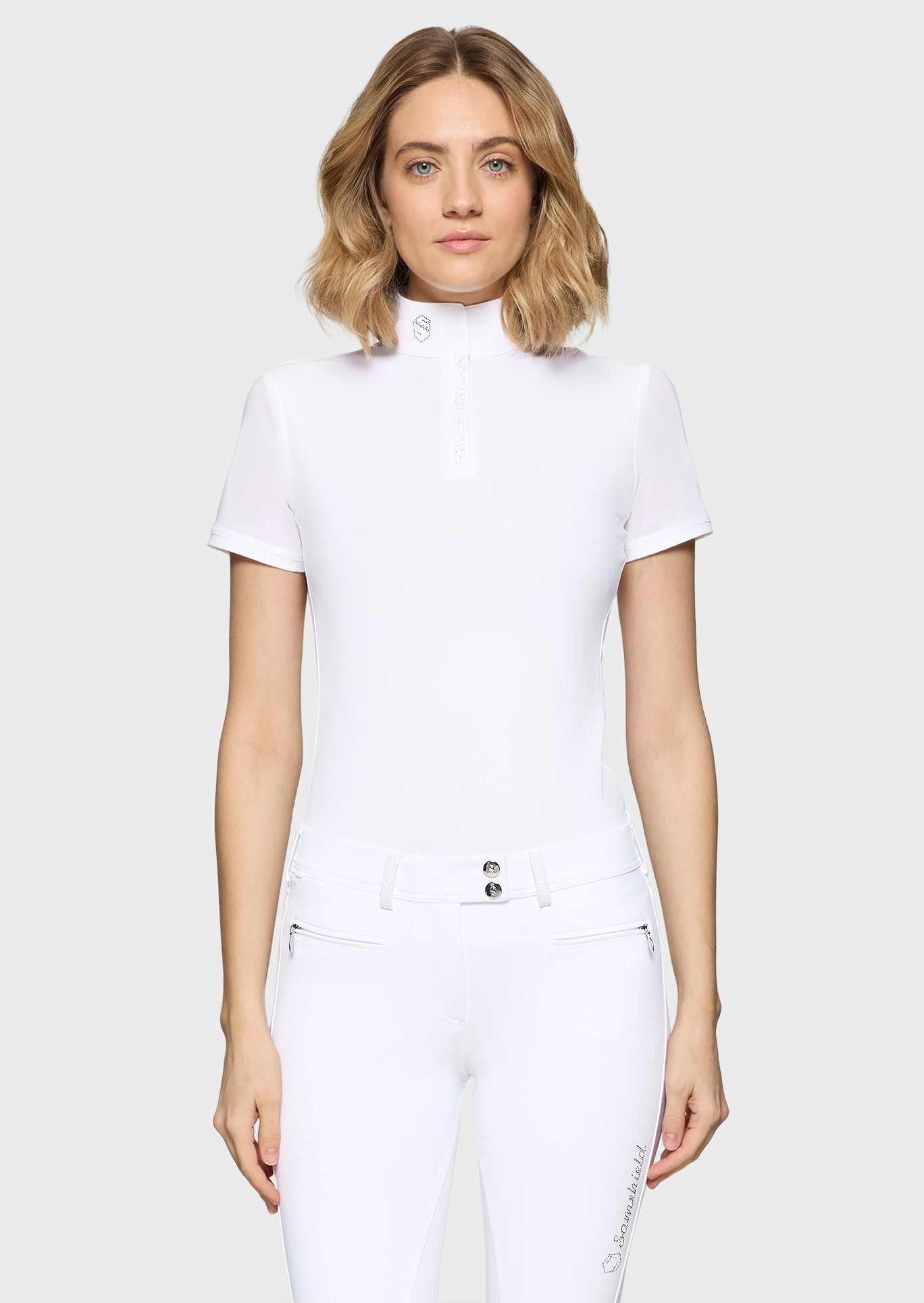 Woman wearing a white outfit on a white background