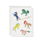 Greeting card with colorful horse illustrations and 'Happy Birthday!' text on a white background