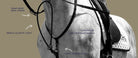 Close-up of a horse wearing equestrian tack, with overlaid text and arrows pointing to labeled areas including tear drop rein loops, single elastic loop, luxurious leather martingale, and loop connection on a beige background.