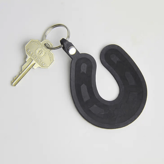 genuine leather keychain in the shape of a lucky horseshoe.