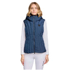 A woman modeling a sleeveless navy blue puffer vest with a front zipper and hood, worn over a white long-sleeve top and white leggings against a light gray studio background.