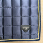 A close-up of a quilted navy blue