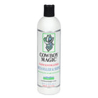 A white plastic bottle of Cowboy Magic Concentrated Retangler & Shine hair instant, featuring a black cap and a white label with green, red, and blue text and graphics.