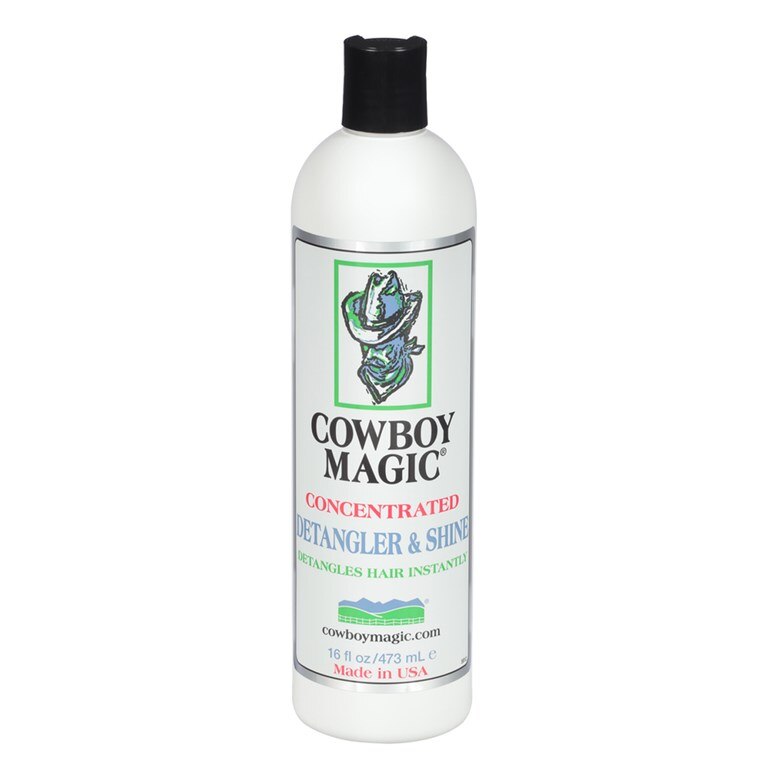 A white plastic bottle of Cowboy Magic Concentrated Retangler & Shine hair instant, featuring a black cap and a white label with green, red, and blue text and graphics.