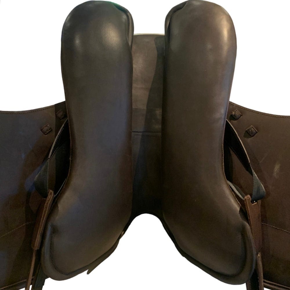 Brown saddle against a white background