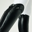 Black protective gear on a mannequin arm with a white background