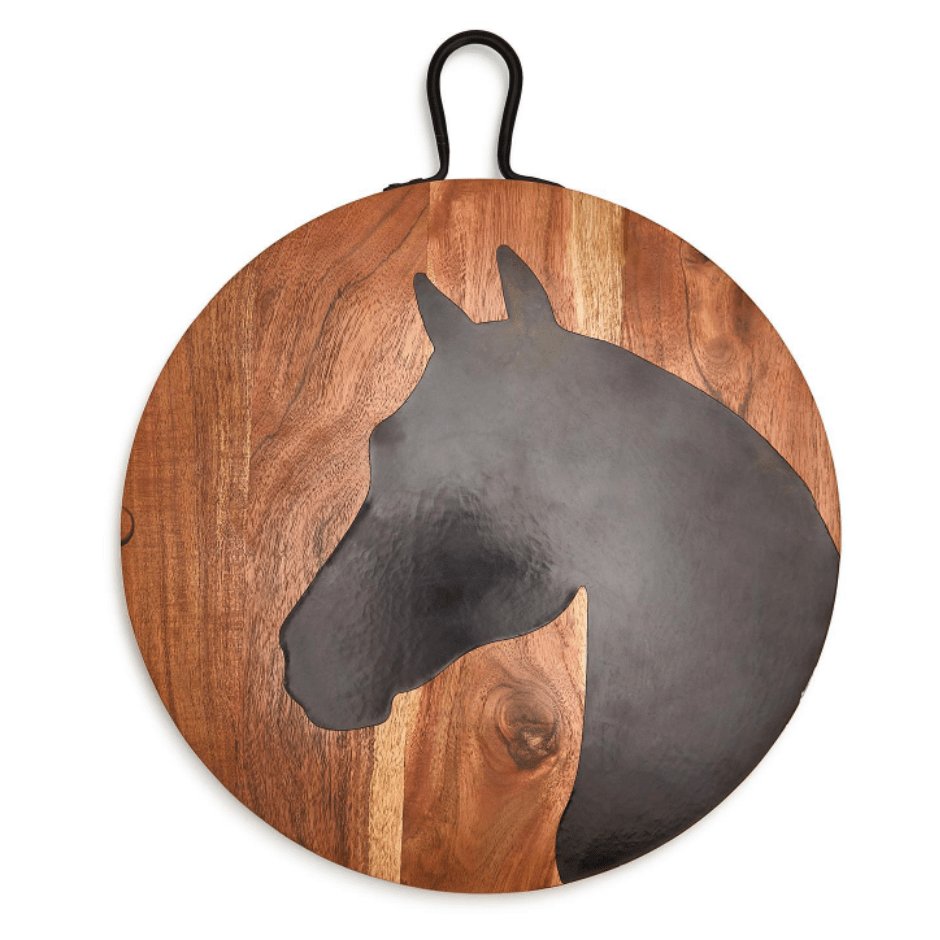 Round wooden board with a horse head profile. 