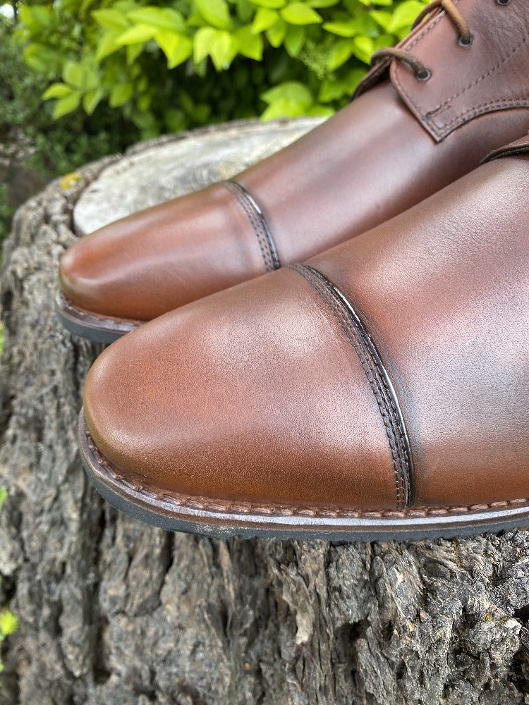 Custom toe with rolled patent piping